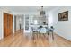 Bright dining area featuring an open layout, hardwood floors, and stylish modern decor at 1205 Druid Knoll Ne Dr, Brookhaven, GA 30319