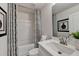 Clean bathroom showcasing a vanity, toilet, tub with shower, and neutral-patterned shower curtain at 5473 Blossomwood Sw Trl, Mableton, GA 30126