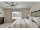 Well-lit bedroom featuring a ceiling fan at 5473 Blossomwood Sw Trl, Mableton, GA 30126
