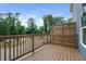 Relaxing deck with wooden railings overlooking a well-maintained landscape, perfect for outdoor enjoyment at 5473 Blossomwood Sw Trl, Mableton, GA 30126