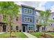 Beautiful townhome exteriors feature colorful facades, manicured lawns, and inviting walkways at 5473 Blossomwood Sw Trl, Mableton, GA 30126
