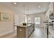 Bright kitchen with granite island, stainless appliances, and views to outdoor deck at 5473 Blossomwood Sw Trl, Mableton, GA 30126