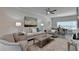 Comfortable living room has large windows and a decorative fireplace at 5473 Blossomwood Sw Trl, Mableton, GA 30126