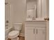 Clean bathroom with a vanity, toilet, and a shower-tub combination at 5477 Blossomwood Sw Trl, Mableton, GA 30126