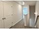 Carpeted hallway leading to additional bedrooms and bathrooms upstairs at 5477 Blossomwood Sw Trl, Mableton, GA 30126