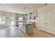 Open kitchen with stainless steel appliances, gray cabinets, and granite countertops at 5477 Blossomwood Sw Trl, Mableton, GA 30126