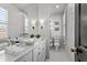 Modern bathroom with a white vanity, vessel sink, and decorative wall sconces at 620 Camp Ave, Roswell, GA 30075