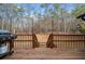 Outdoor deck with stairs and a grill, surrounded by trees and nature at 6808 Greenoak Dr, Douglasville, GA 30135