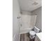 The bathroom features a shower-tub combo with gold hardware and grey vinyl plank flooring at 475 Lakeside Cir, Covington, GA 30016