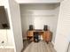 Converted bedroom closet with luxury vinyl plank flooring, a desk, and overhead storage at 475 Lakeside Cir, Covington, GA 30016