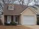 Charming single-Gathering home features stone accents, a one-car garage, and a well-maintained front yard at 475 Lakeside Cir, Covington, GA 30016