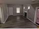 A living room featuring a fireplace, windows, and view of a door to the backyard at 475 Lakeside Cir, Covington, GA 30016
