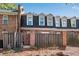 View of the rear of the townhome from the backyard at 5 Spring Green Pl, Atlanta, GA 30318