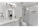Modern bathroom featuring a glass shower, tiled walls, and a sleek vanity at 5 Spring Green Pl, Atlanta, GA 30318
