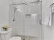 Stylish bathroom featuring a tiled shower with glass doors, and modern fixtures at 5 Spring Green Pl, Atlanta, GA 30318