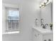 Bright bathroom with a large window, sink vanity, and modern fixtures at 5 Spring Green Pl, Atlanta, GA 30318