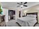 Bedroom featuring a large bed, closet storage, dresser with TV and natural light at 5 Spring Green Pl, Atlanta, GA 30318