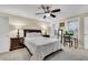 Cozy bedroom with carpet, ceiling fan, a large bed, and a window offering natural light at 5 Spring Green Pl, Atlanta, GA 30318
