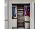 Organized walk-in closet with shelving, drawers, and ample storage space at 5 Spring Green Pl, Atlanta, GA 30318