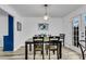 Cozy dining area featuring laminate flooring and a modern chandelier at 5 Spring Green Pl, Atlanta, GA 30318