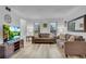 Inviting living room with laminate flooring, neutral colors and lots of natural light at 5 Spring Green Pl, Atlanta, GA 30318