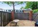 Cozy patio with brick accent wall, wooden fence, and seating for relaxing outdoors at 5 Spring Green Pl, Atlanta, GA 30318