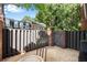View of private patio with brick wall, wooden fence, and serene outdoor space at 5 Spring Green Pl, Atlanta, GA 30318