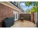 Private brick patio with table and grill at 5 Spring Green Pl, Atlanta, GA 30318