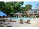 Community pool surrounded by lounge chairs and tables at 5 Spring Green Pl, Atlanta, GA 30318
