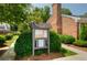 Community bulletin board provides residents with important updates, surrounded by manicured landscaping at 5 Spring Green Pl, Atlanta, GA 30318