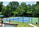 Community tennis courts offer residents a great recreational amenity amidst lush greenery at 5 Spring Green Pl, Atlanta, GA 30318