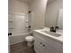 Bathroom featuring a white vanity, shower, and black fixtures at 5463 Blossomwood Sw Trl, Mableton, GA 30126