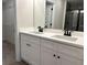 Bathroom featuring double sink vanity with a view into the walk-in closet and shower at 5463 Blossomwood Sw Trl, Mableton, GA 30126