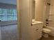 Elegant bathroom with a shower and tub, featuring a white vanity and modern fixtures for a spa-like experience at 5463 Blossomwood Sw Trl, Mableton, GA 30126