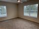 Inviting bedroom with large windows and neutral tones, perfect for creating a serene and comfortable retreat at 5463 Blossomwood Sw Trl, Mableton, GA 30126