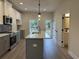 Kitchen featuring gray and white cabinets, an island, and stainless steel appliances at 5463 Blossomwood Sw Trl, Mableton, GA 30126