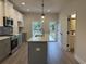 Open kitchen with a central island, stainless steel appliances, and stylish cabinets at 5463 Blossomwood Sw Trl, Mableton, GA 30126