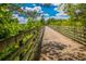 A tranquil walking trail surrounded by lush greenery, inviting outdoor adventures at 5463 Blossomwood Sw Trl, Mableton, GA 30126