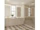 Luxurious bathroom featuring dual sinks, elegant fixtures, and a spacious shower with glass surround at 60 Douglas Se St, Atlanta, GA 30317