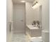 Bright bathroom featuring a double vanity, stylish lighting and patterned floor at 60 Douglas Se St, Atlanta, GA 30317