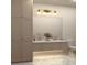 Elegant bathroom with custom cabinets, large mirror, and stylish patterned floor tiles at 60 Douglas Se St, Atlanta, GA 30317