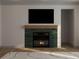 Cozy living room with fireplace featuring a dark green tiled surround at 60 Douglas Se St, Atlanta, GA 30317