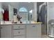 Bathroom featuring dual sinks, and white cabinets at 1507 Smithfield Dr, Mcdonough, GA 30252