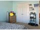 Light-filled bedroom featuring a double closet, storage, and bright walls at 1507 Smithfield Dr, Mcdonough, GA 30252