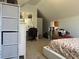 Sunlit bedroom features a dedicated vanity area with a sleek desk and plentiful storage options at 1507 Smithfield Dr, Mcdonough, GA 30252
