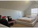 Bright bedroom with a large window, providing ample natural light, and a cozy sleeping space at 1507 Smithfield Dr, Mcdonough, GA 30252