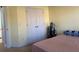 Second bedroom featuring double closet, neutral walls, and tan carpeting at 1507 Smithfield Dr, Mcdonough, GA 30252