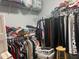 Walk-in closet with ample storage and clothing racks at 1507 Smithfield Dr, Mcdonough, GA 30252