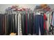 Clothing neatly displayed in a walk-in closet, providing organized storage at 1507 Smithfield Dr, Mcdonough, GA 30252