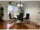 Stylish dining room with modern seating and a sleek glass-top table, bathed in natural light at 1507 Smithfield Dr, Mcdonough, GA 30252